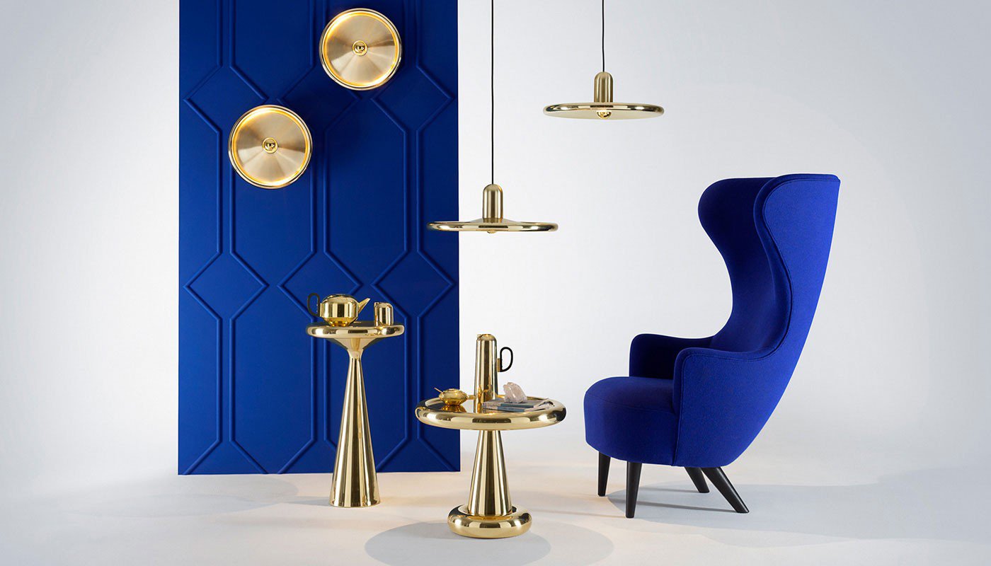 Tom Dixon Wingback chair lifestyle in blue - Brass lighting. Available at Heal's