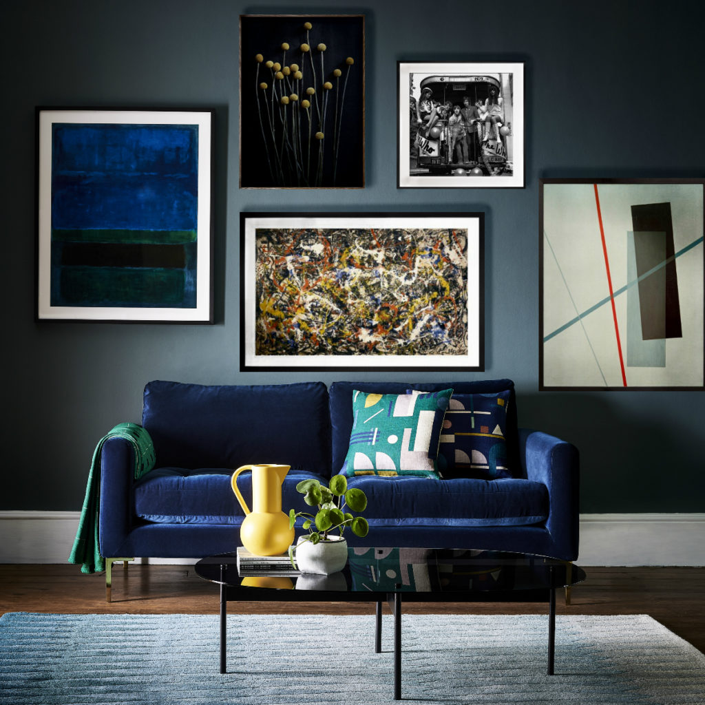 Blue Eton Sofa with a picture wall