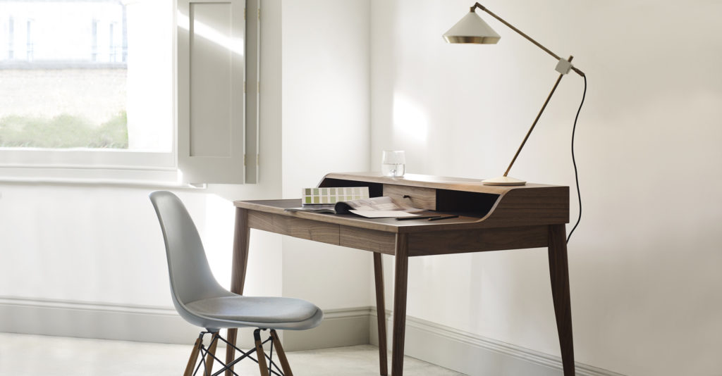 An Eames Plastic Chair as a desk chair in a home office