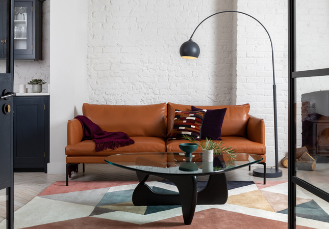 Leather-upholstered Matera Sofa in a modern, industrial room