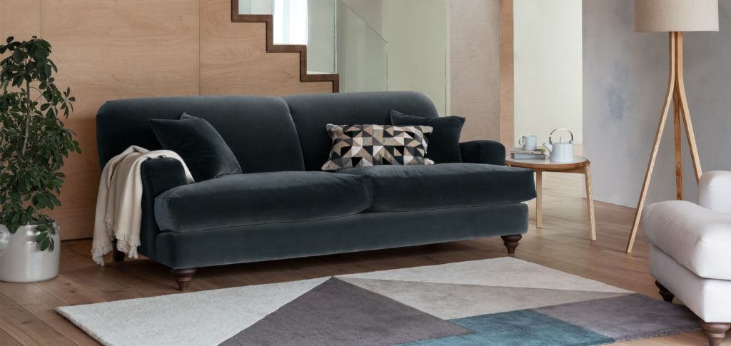 Grey sofa with wooden floor