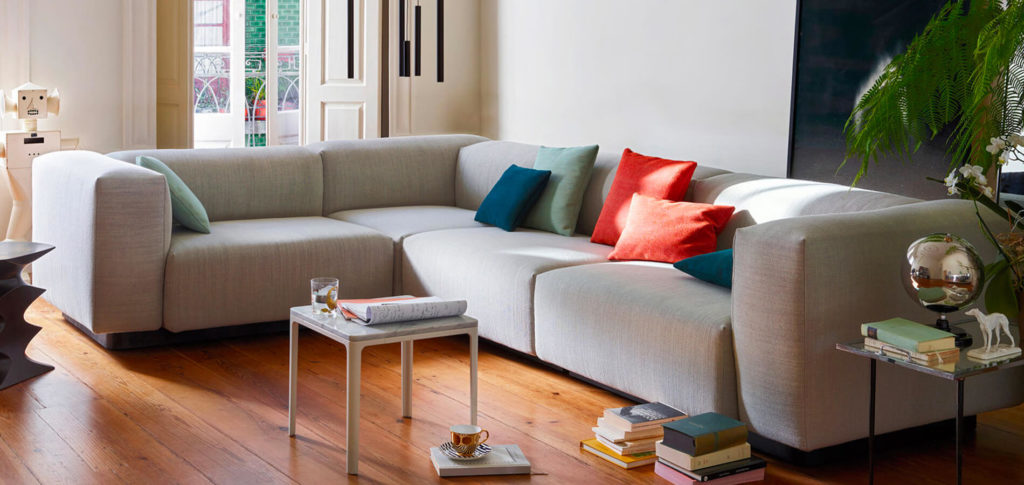 Grey Vitra sofa with colourful cushions