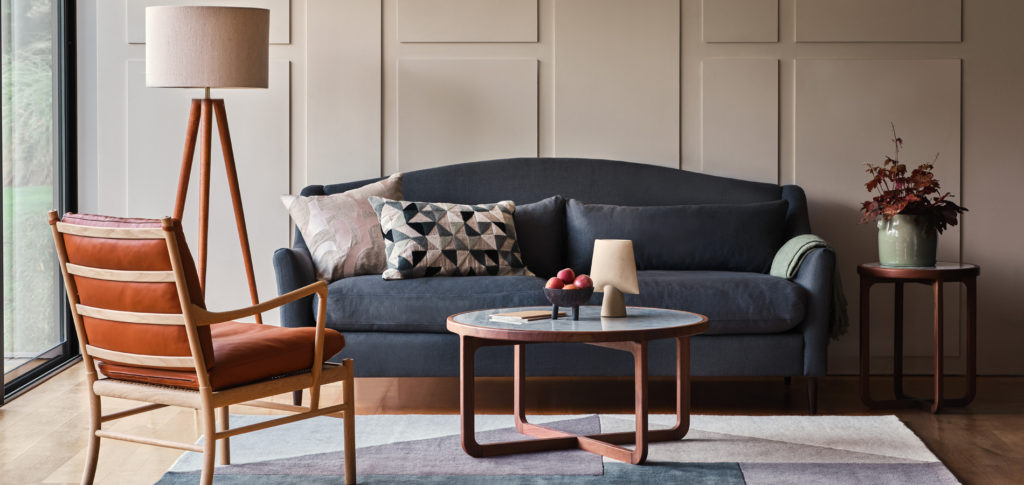 Grey sofa with blue toned cushions