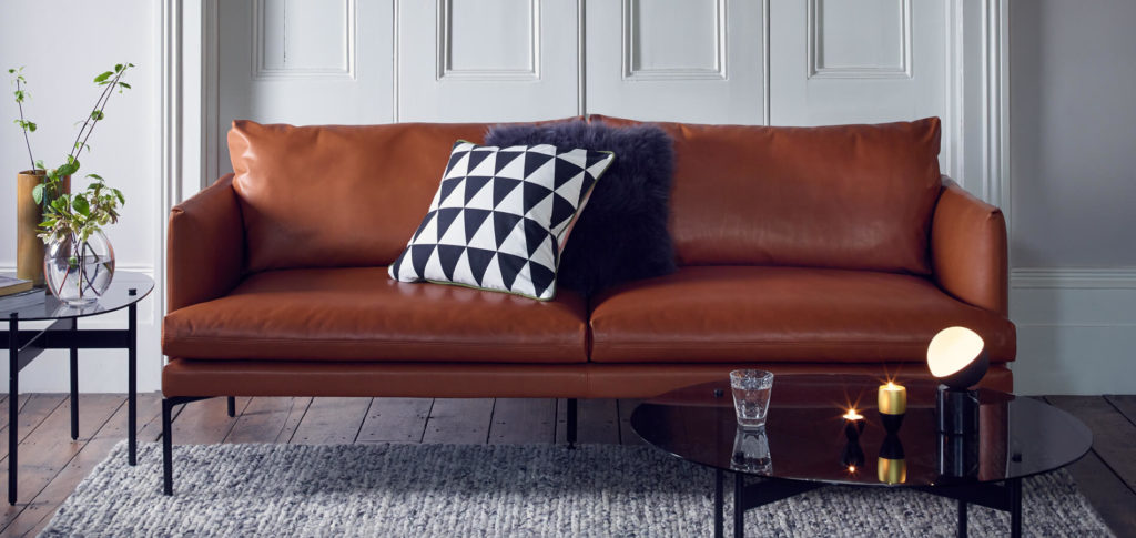 Matera Brown Leather Sofa with black and white cushion