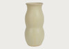A speckled ceramic vase with a textured cream-beige finish, featuring a unique double-bulbous silhouette, set against a solid off-white background.