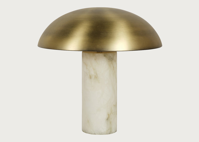 A mushroom-shaped table lamp with a brushed brass dome-shaped shade and a cylindrical alabaster base, shown against a light gray background.
