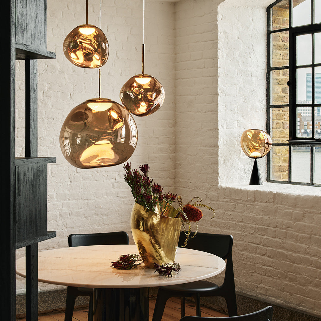 Melt LED pendant lights and table lamp in bronze by Tom Dixon