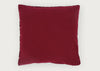 A square deep burgundy velvet throw pillow with decorative metallic trim along the edges, shown against a plain light gray background.
